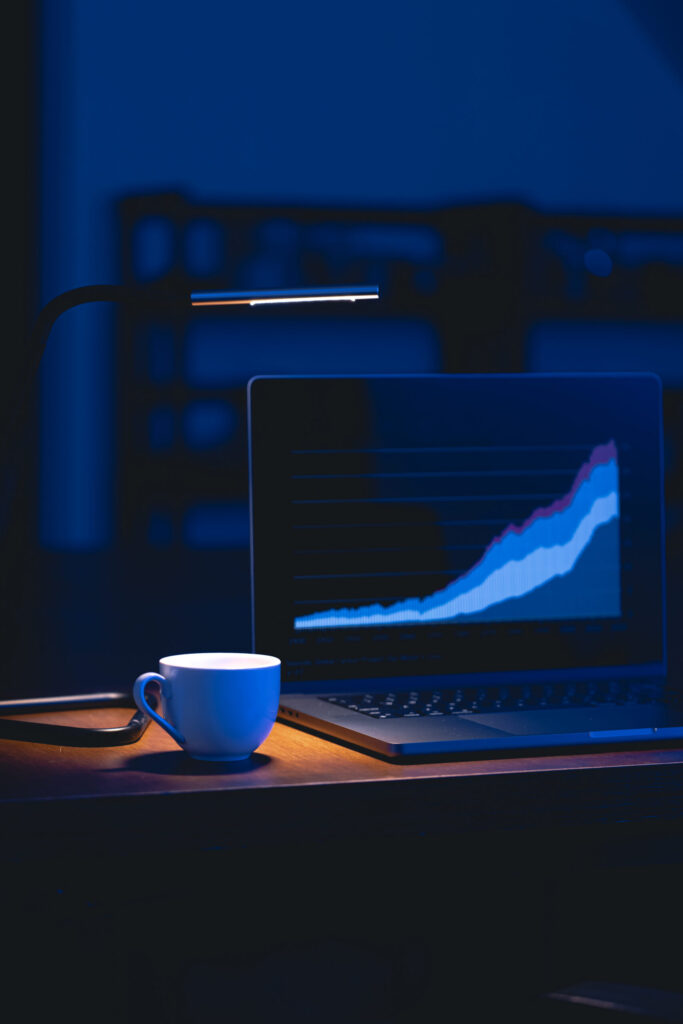 Digital marketing agency in Sharjah team story with laptop showing growth chart