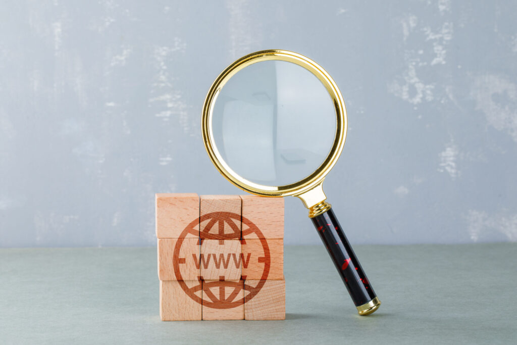 On-page SEO analysis concept with magnifying glass focusing on website elements