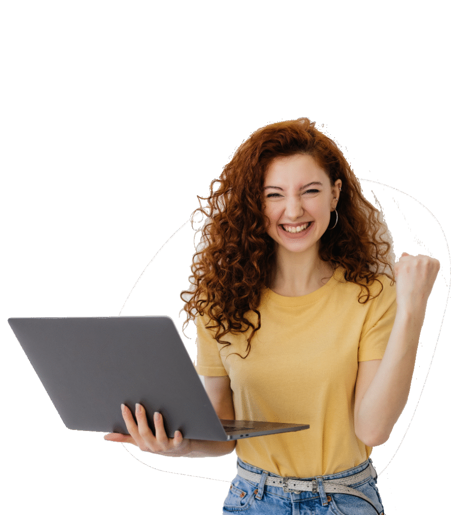 Smiling woman holding a laptop celebrating success
